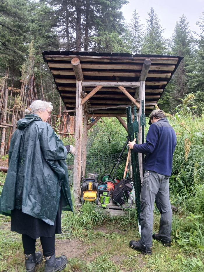 Melissa and Leo getting ready to set up some tree cages 