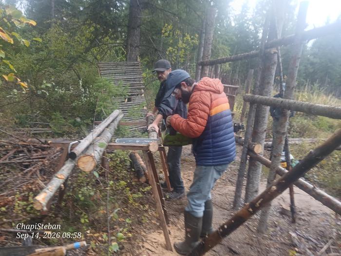 Sam notching some support piece, Dan running point on their tasks 