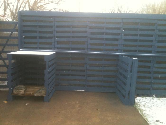 Fence completed with snow. The covered area is for firewood for the firepit.