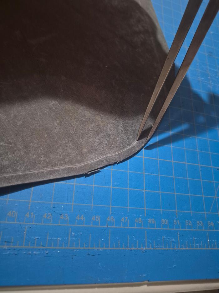 Scribing the leather with calipers
