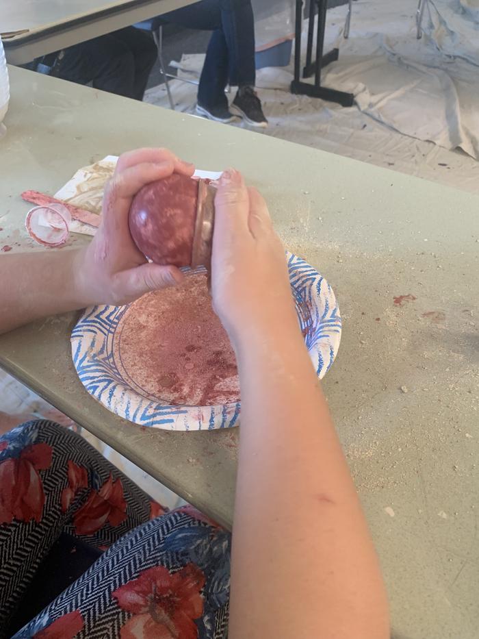 hand polishing a dorodango ball