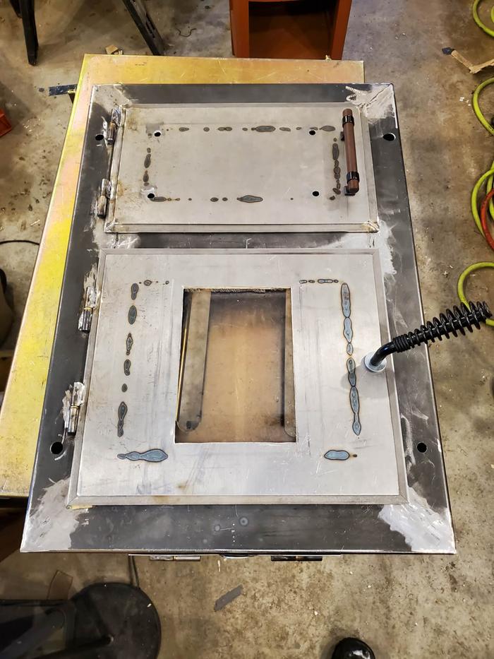 Weld, grind, repeat until smooth. This is the process of a novice welder.