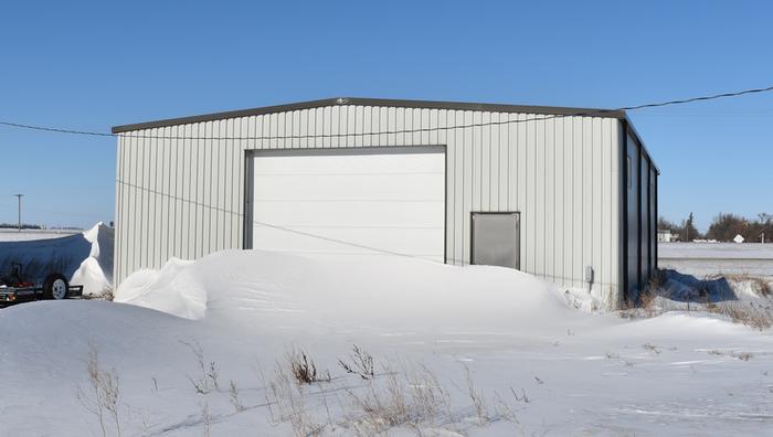 Before the work...note the hint of a door handle on the man door