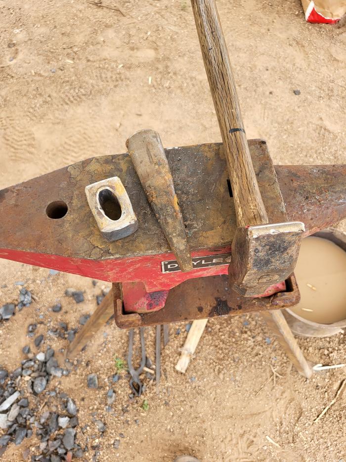 Hammer and drift -- we used the slit and drift method to make the hole for the handle.