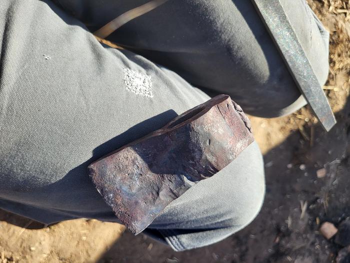 Following forging the blade edge and truing the blade to the hole for the handle.