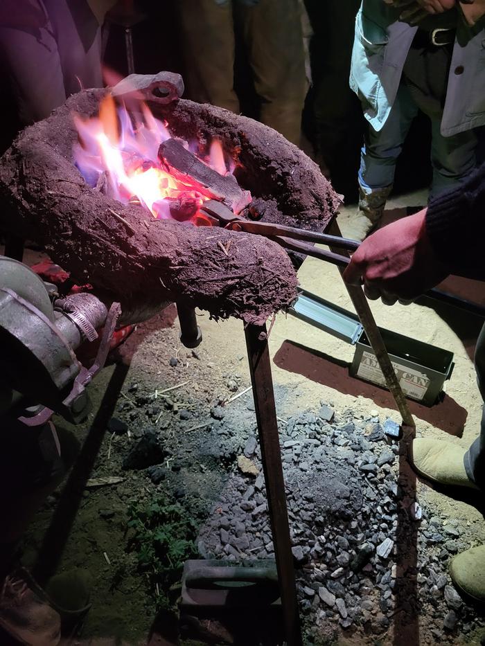 Heat treatment conducted at night to aid in seeing the hot steel coloration.