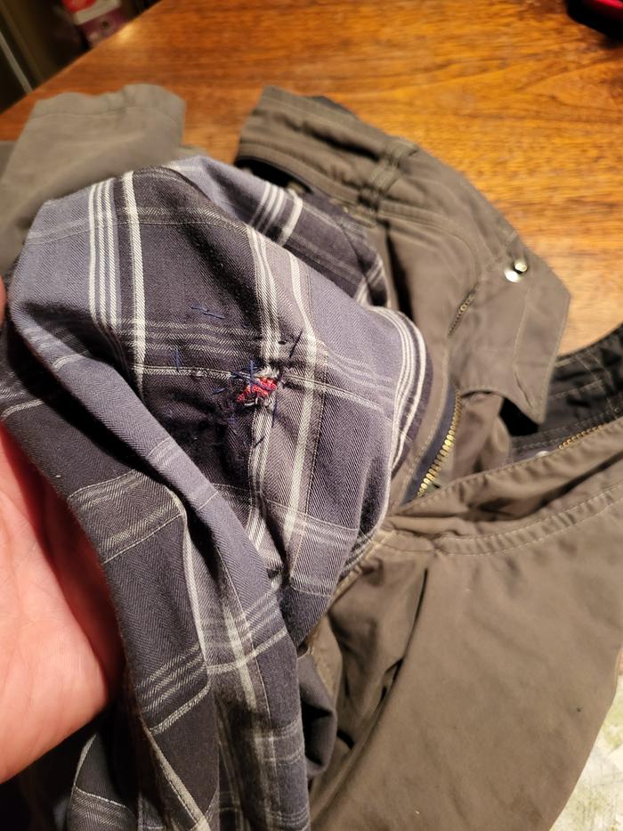 Gaining an appreciation for the work Alex has done in mending our clothes...