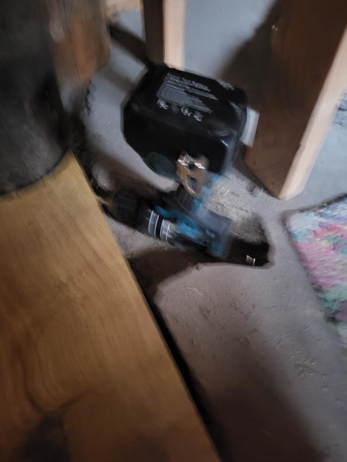 Strategic removal of the earthen floor to allow for tool access -- the cob will be rebuilt!