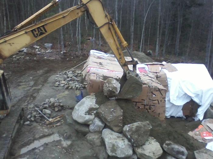 adding a rock to the southwest retaining wall, October