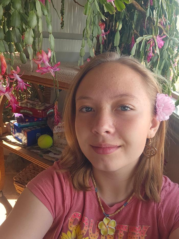 My daughter with a flower in her hair, flowering cactus behind her. So many lovely shades of pink. I just love the spring!!