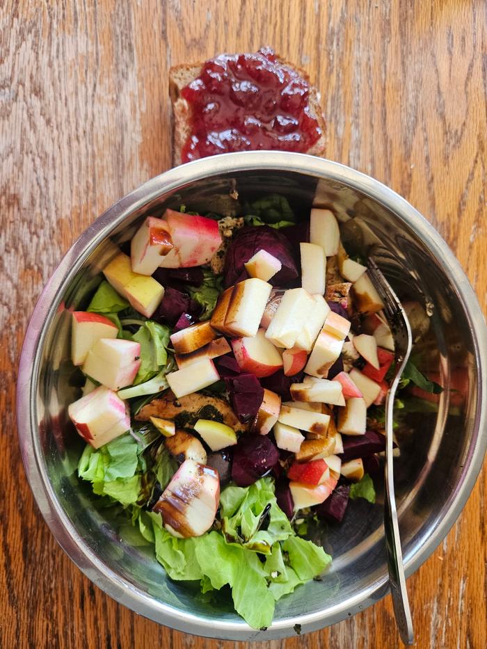 Salad greens, roasted beets, chopped apple, huckleberry vinegar and sourdough roll with jam on the side 