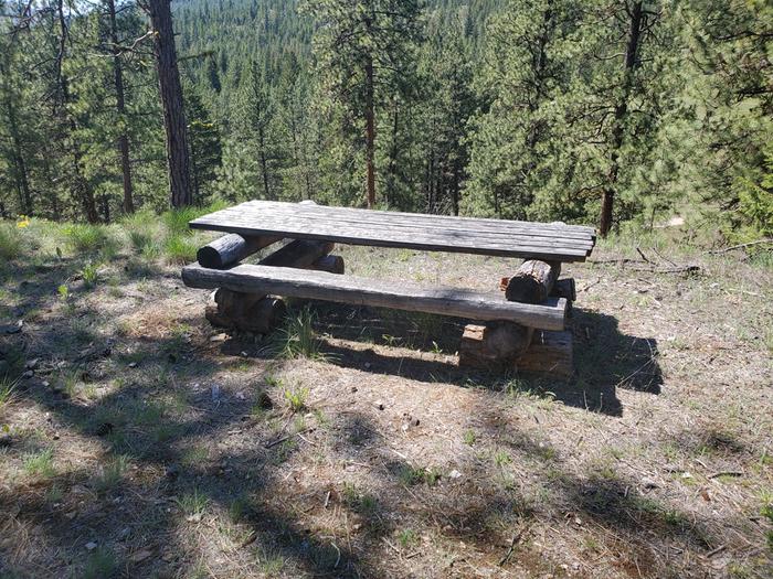 log picnic table near the top of the volcano