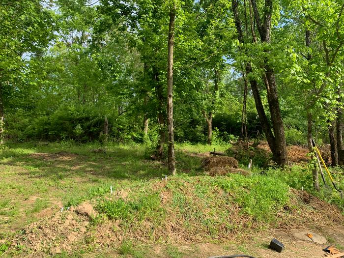 The point-of-view in this picture would be looking directly towards the highest point. The greatest slope.