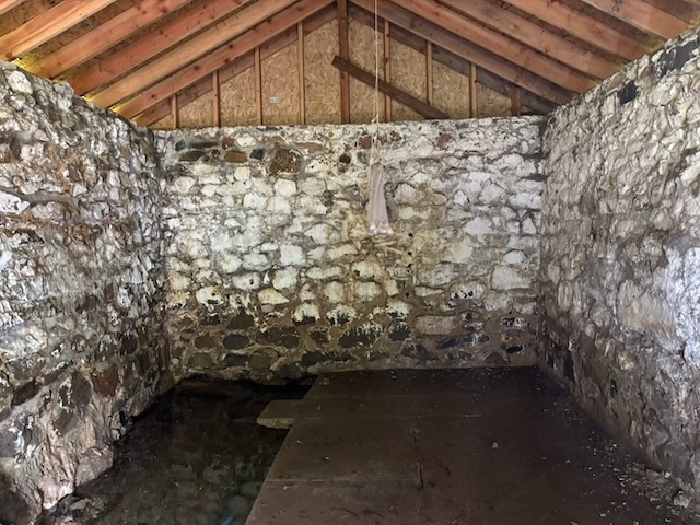 Inside the spring house. I briefly experimented with storing garlic in there (and also installed a temperature monitor), but it got too hot in the summer and cold in the winter.