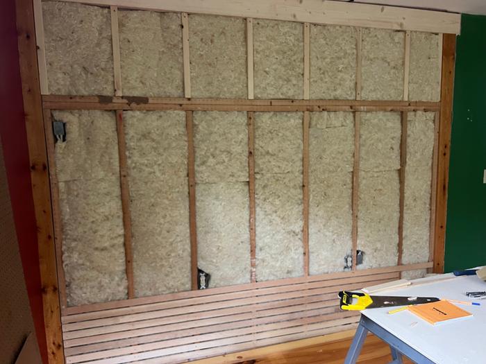 wall framed and wool insulation batts installed