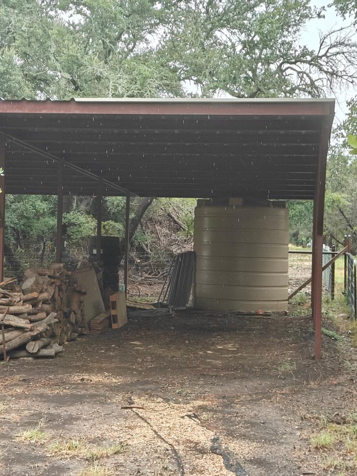 3k gal tank at Pole Barn on highest point of property. Kris the pool full a week as thirteen 55 gal drums located at various places downhill, for watering gardens and trees