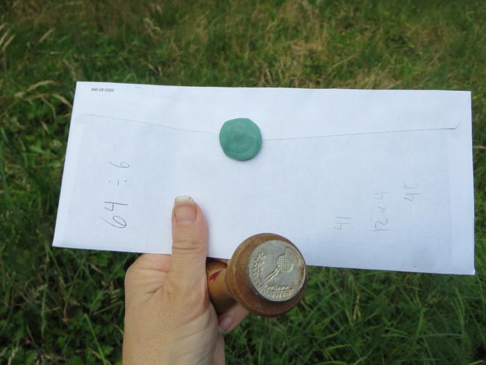 I tested the wax last night on an envelope. The stamp design is really hard to see! It sticks to the paper nicely, though.