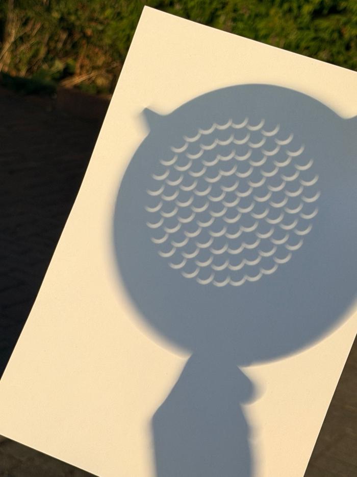Solar eclipse as safely projected at c. 91% through a colander