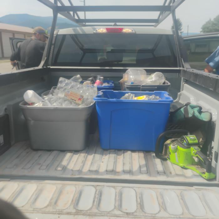 Taking recycling in the back of a small truck