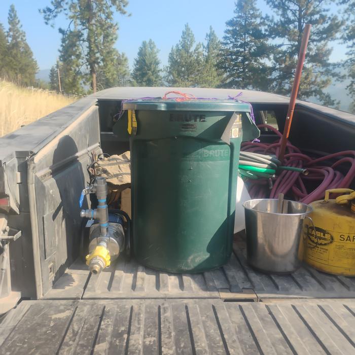 WILLOW FEEDER BIN AND IRRIGATION SUPPLIES IN THE BACK OF T-ROB