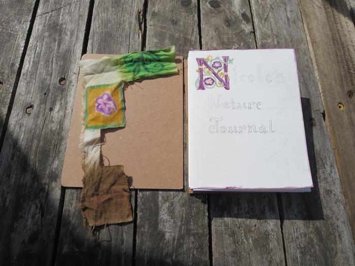 My test book with it's watercolor paper, chipboard, and the colored cotton