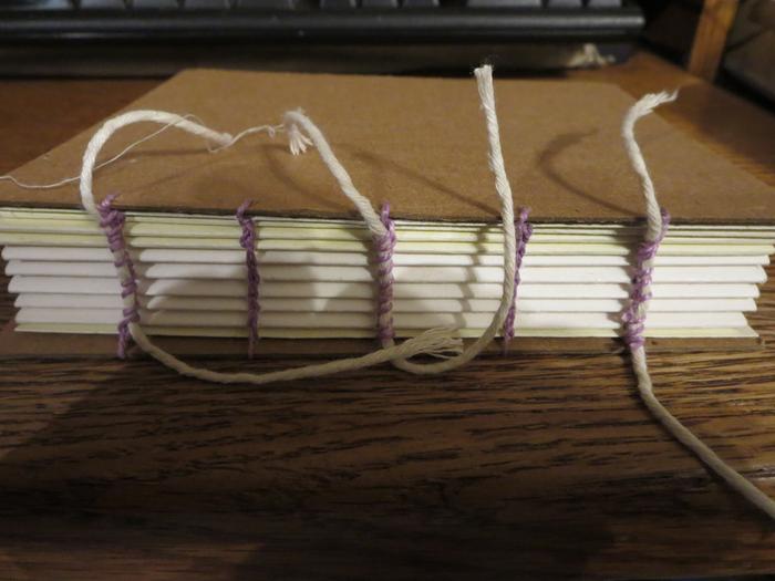 Inspired by Nina, I wanted to see if I could give this Coptic binding faux cords. I just used my thread to wrap them onto the binding