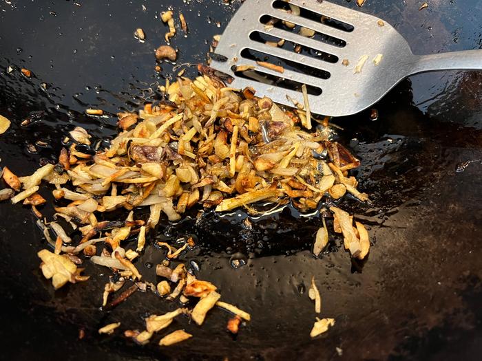 stir frying mixed root perennial vegetables