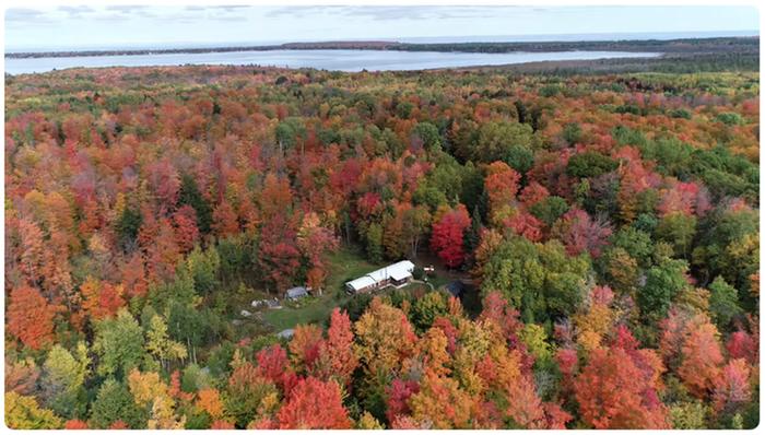 Looking over farm toward Lake Independence & Lake Superior beyond