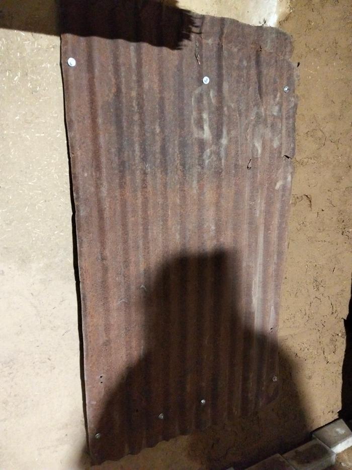 A heat shield was installed on the back wall to make the most of the heat on that side as well—a great way to put some recycled materials to use.