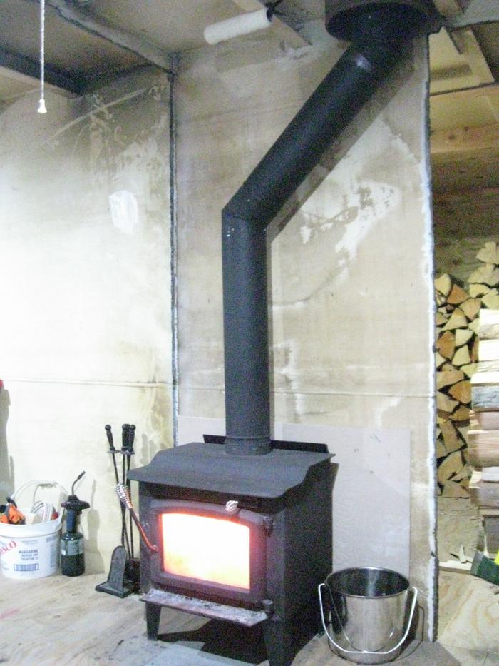 the upper living room note the walls of glass and the chimney