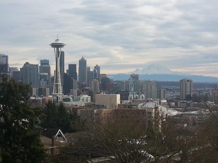 space needle skyline and mt rainier