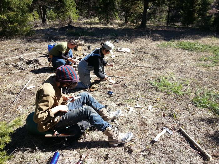 survivalists making and operating bowdrills