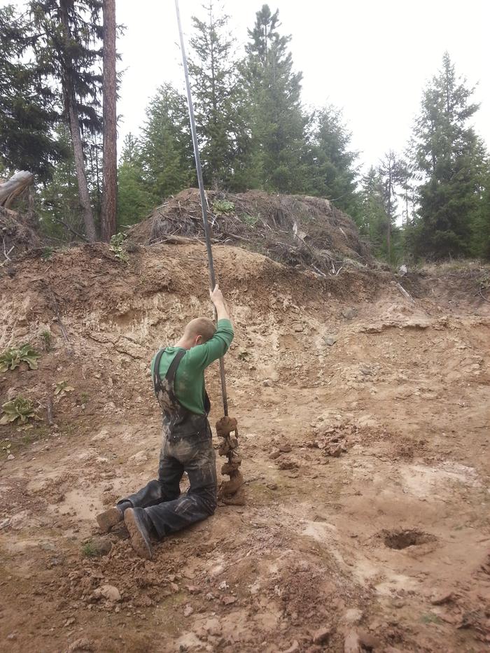 Jim knocking wet clay out of the bit in the Abbey pond hole