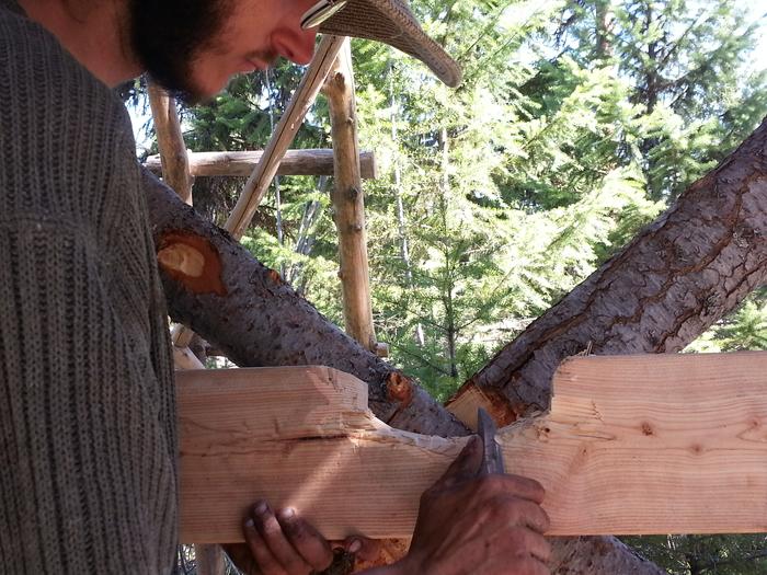 Kai carefully carving out a counter board to fit