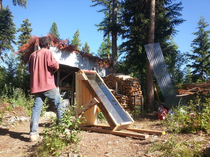 Kai inspecting our dehydrator handiwork