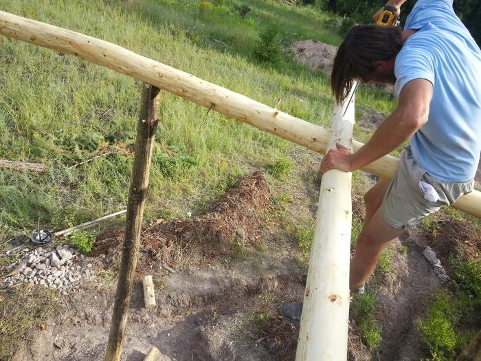 Gabe drilling a hole for the rebar