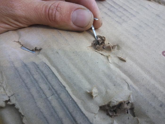 removing staples from cardboard