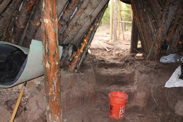 inside dug out debris hut