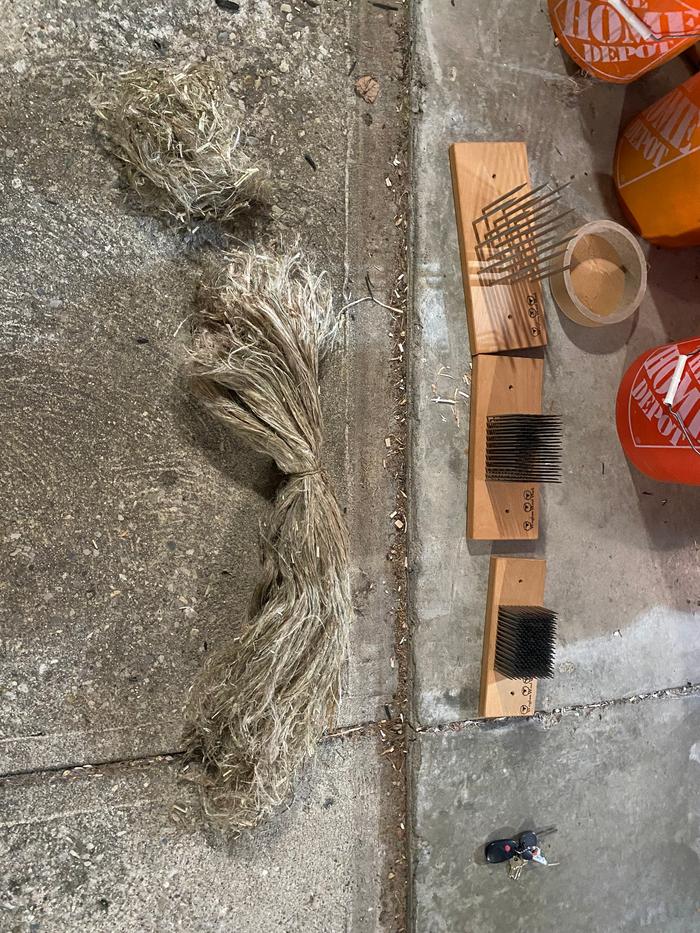 The bundle of nettle fibers next to my set of hackles from Wingham Woolworks.