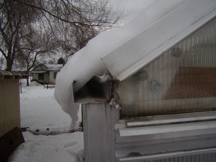 rain-gutter catching snow