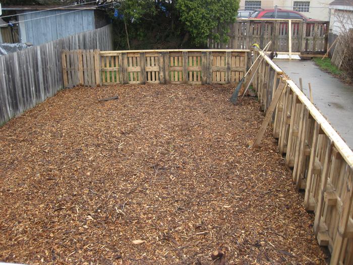 garden area fenced in with chips down