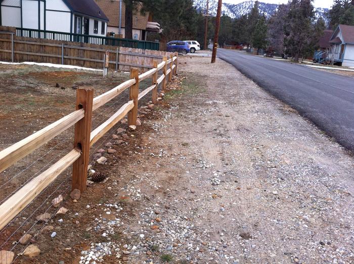 Cedar split-rail fence with wire mesh