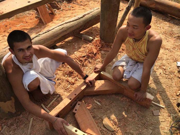 My son and Guangshi from China making the first saw horses