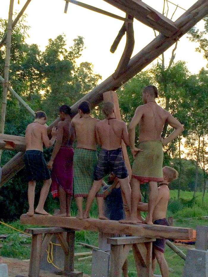 The boys lifting the frame.