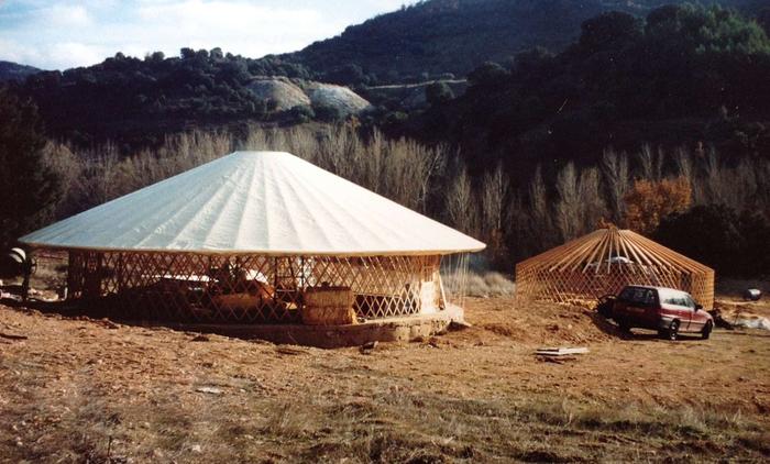 Two yurts rise up