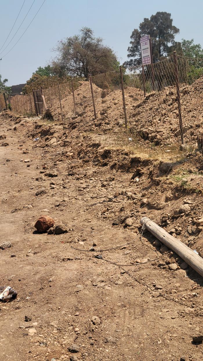 Soil scooped from the road side, dumped into yards close by
