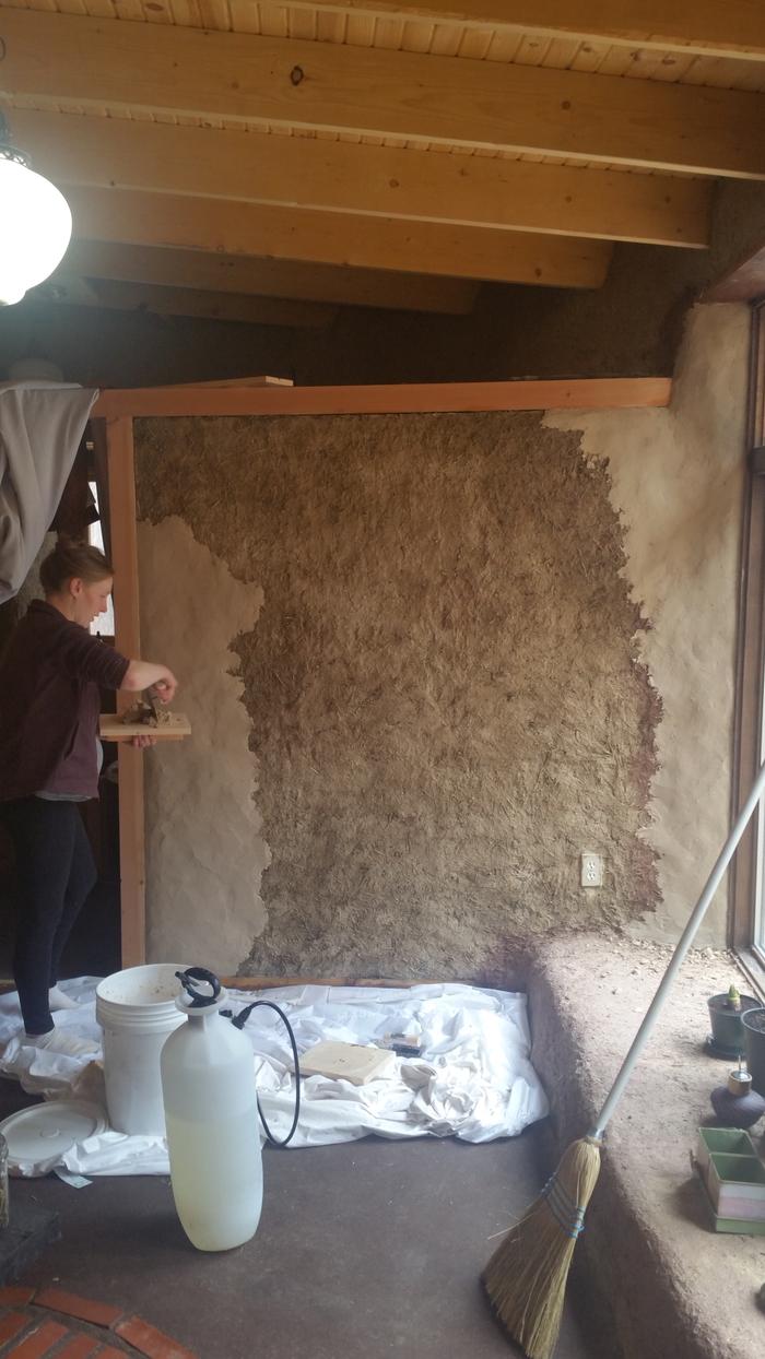 Bathroom wattle daub wall being plastered