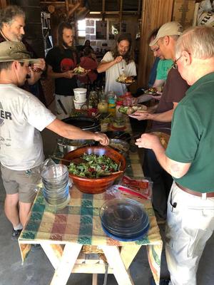 men making tacos at wheaton labs taco buffet