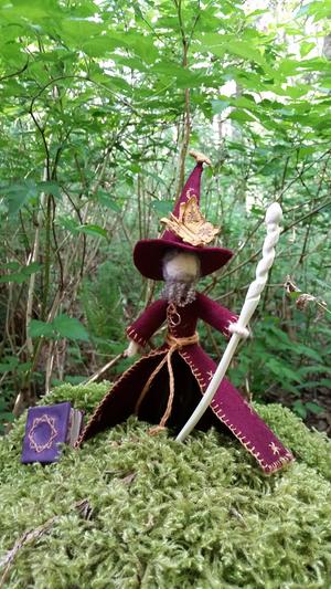 handmade Rincewind figurine with octavo and chaos butterfly