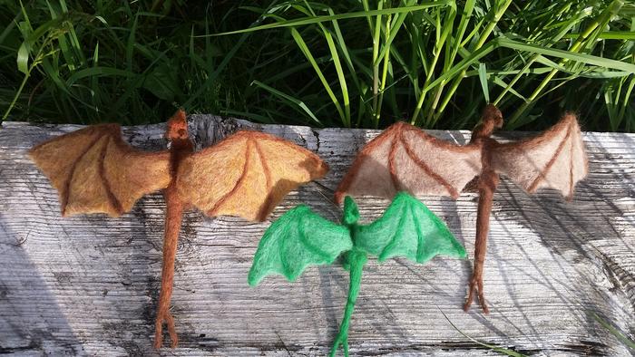 Three needle felted dragons--a bronze, a brown, and a green--from the top down